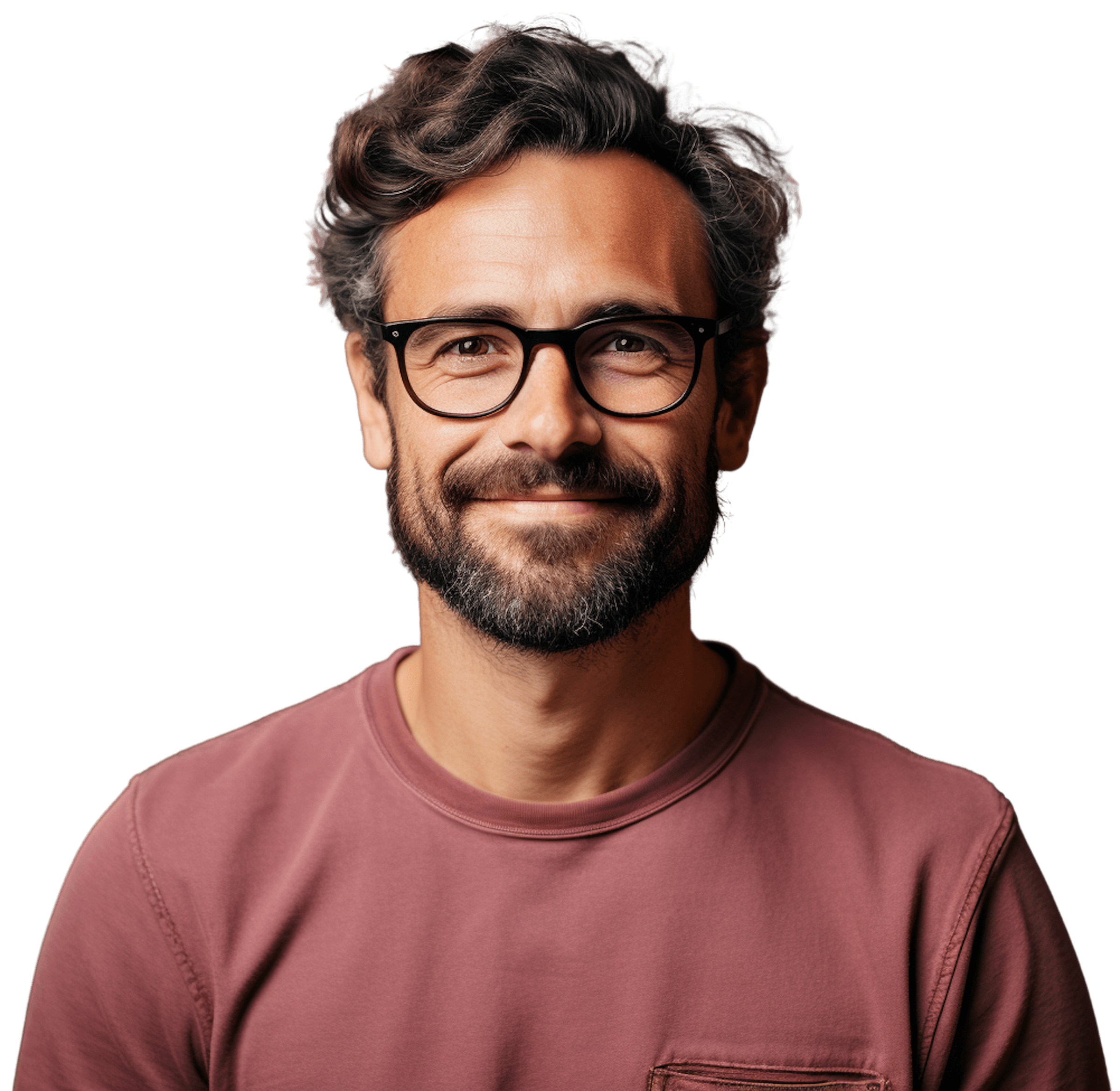 Smiling man with glasses and a beard, wearing a pink shirt, against a plain white background.